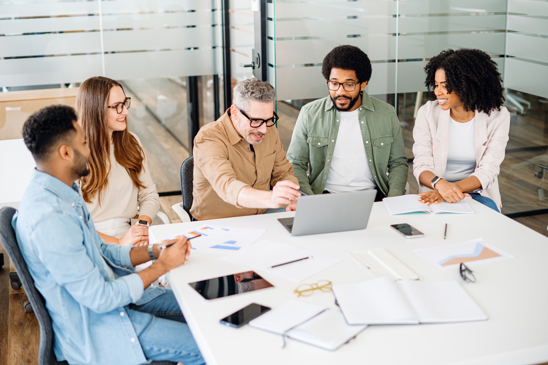 Colleagues engage in a lively exchange of ideas in an office